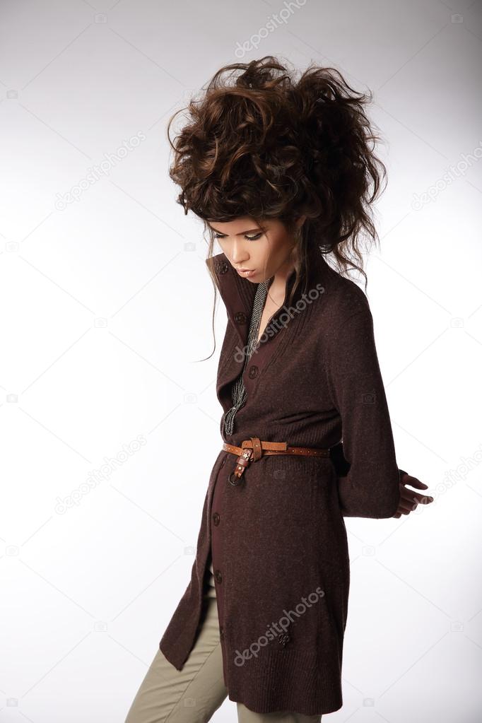 Glamorous Woman in Brown Jacket Looking Down