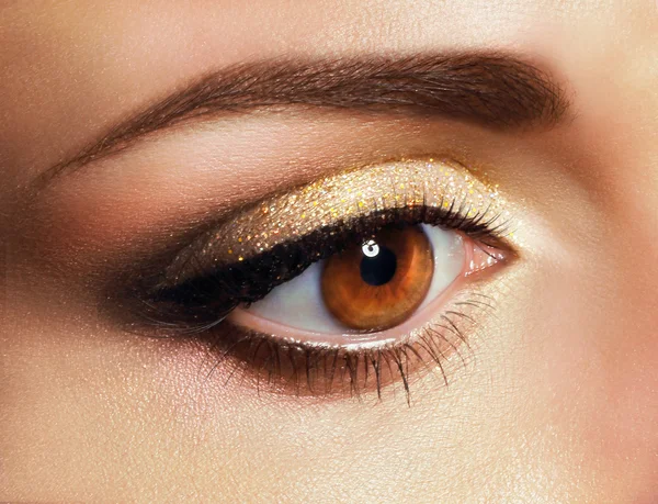 Mascara. Close Up Woman's Eye with Golden Eyeshadow — Stock Photo, Image