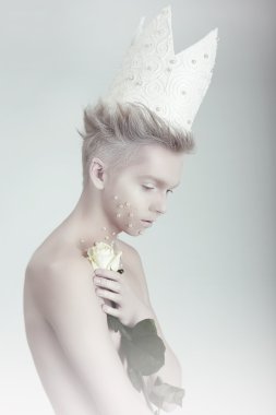Creative Concept. Man in Crown with Flowers