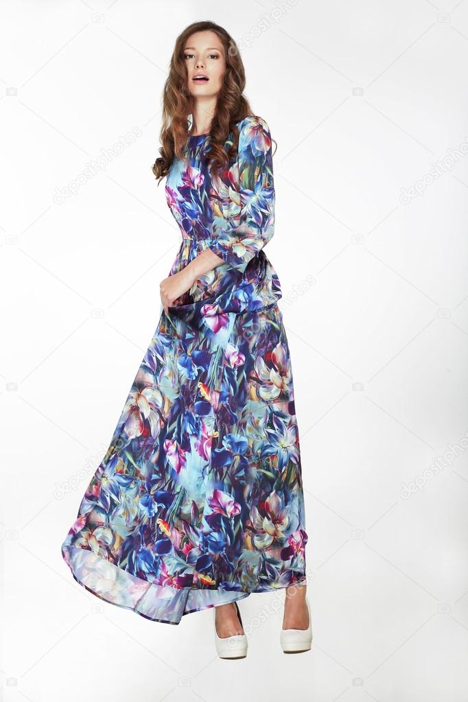Elegant Fashionable Female in Silky Blue Flowery Dress