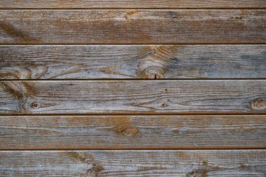 Yakın plan, ahşap masa duvarı. arka plan, gri, kırmızı ve turuncu renklerle güzel desenli..