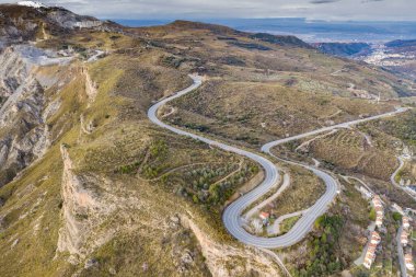 Aerial landscape shot of a snowy Sierra Nevada mountains Granada, Andalucia, Spain