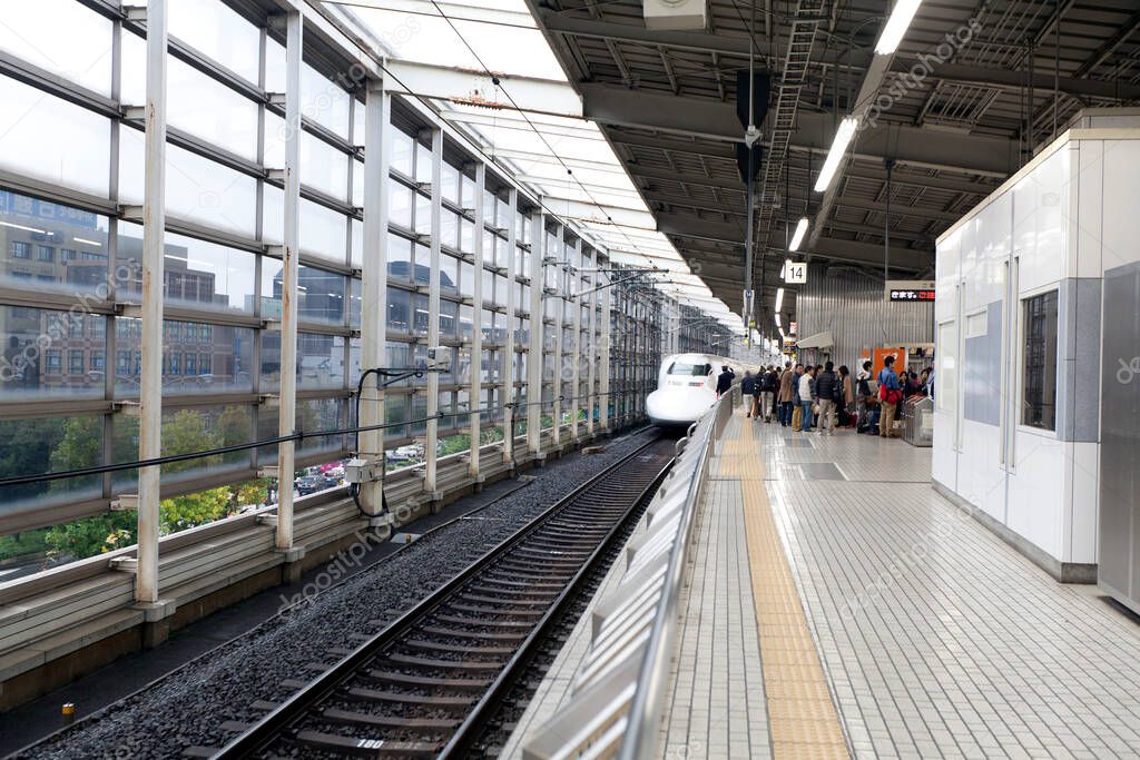 Shinkansen bullet train at Tokyo railway station in Tokyo, Japan. Shinkansen is world's busiest high-speed railway operated by four Japan Railways companies.