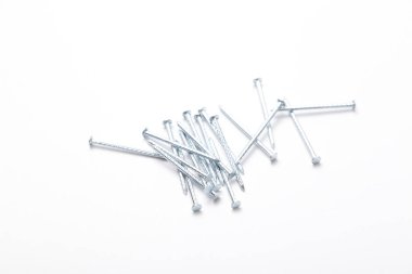 A pile of metal nails isolated on a white background. Small nails isolated on a white background.