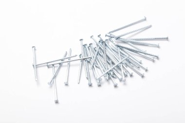 A pile of metal nails isolated on a white background. Small nails isolated on a white background.