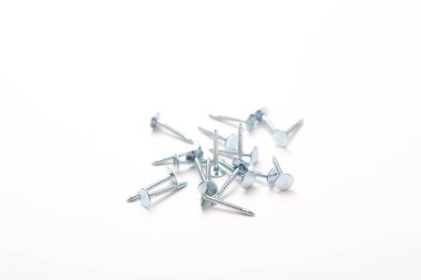 A pile of metal nails isolated on a white background. Small nails isolated on a white background.