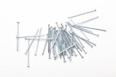 A pile of metal nails isolated on a white background. Small nails isolated on a white background.