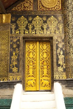 Luang Prabang, Laos 'taki Xieng Tanga Tapınağı' nda duvar süslemesi.. 