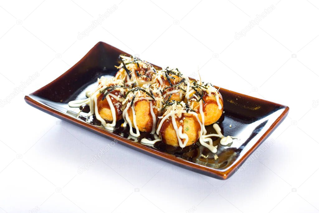 Takoyaki with seasoning and sausage on white background. Japan food style.