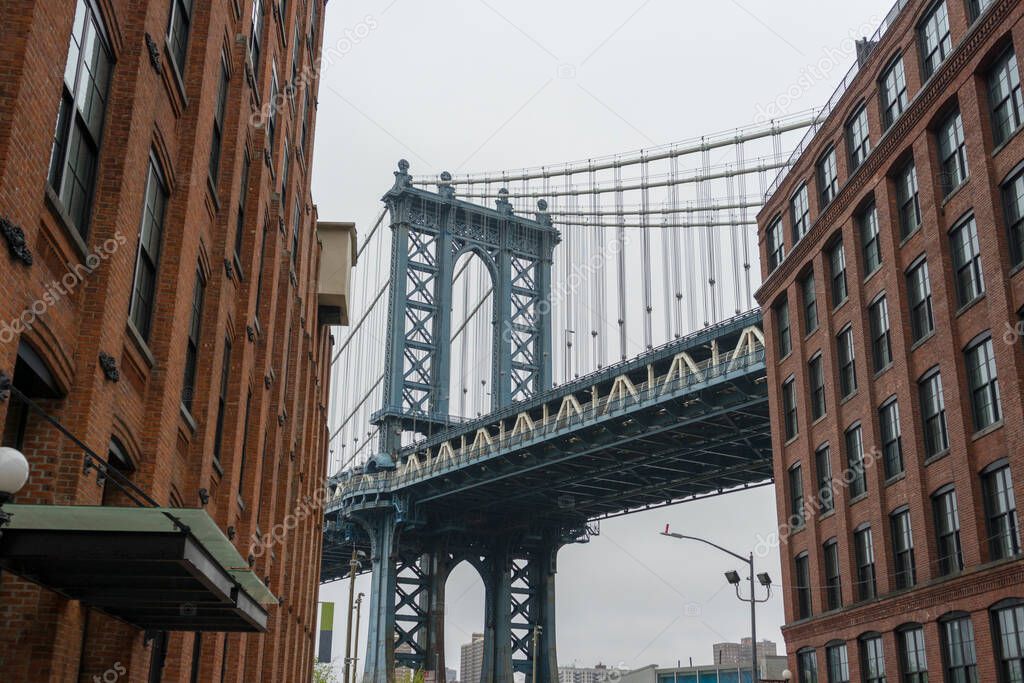 Manhattan bridge view from Brooklyn Dumbo neighborhood in NEW YORK CITY,NY 