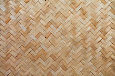 Duvarın arka planı ya da desenleri birbirine dolanmış. Kuru saman ya da duvar gibi sazdan çimenler.