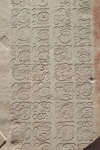 bas-relief carving with Mayan inscription, Mayan alphabet.
