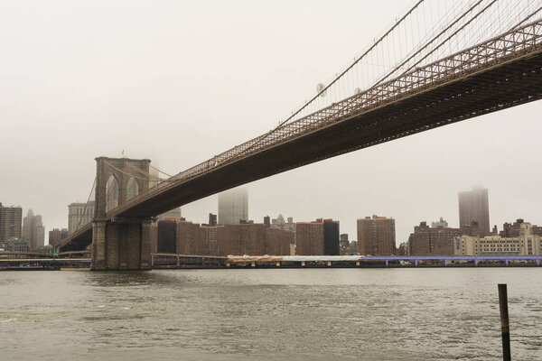 Brooklin Bridge and Manhattan in raining day, New York City, USA