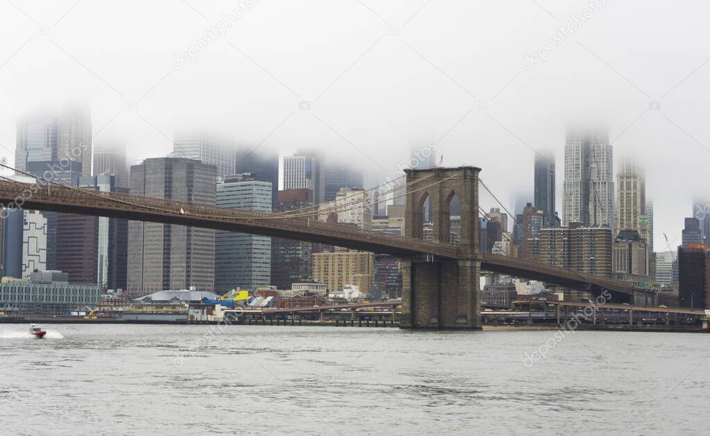Brooklin Bridge and Manhattan in raining day, New York City, USA