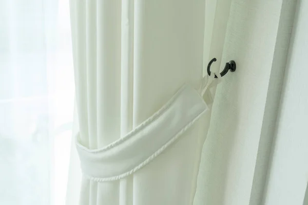 Close up of white tulle on the window. Curtain and window interior decoration at home.