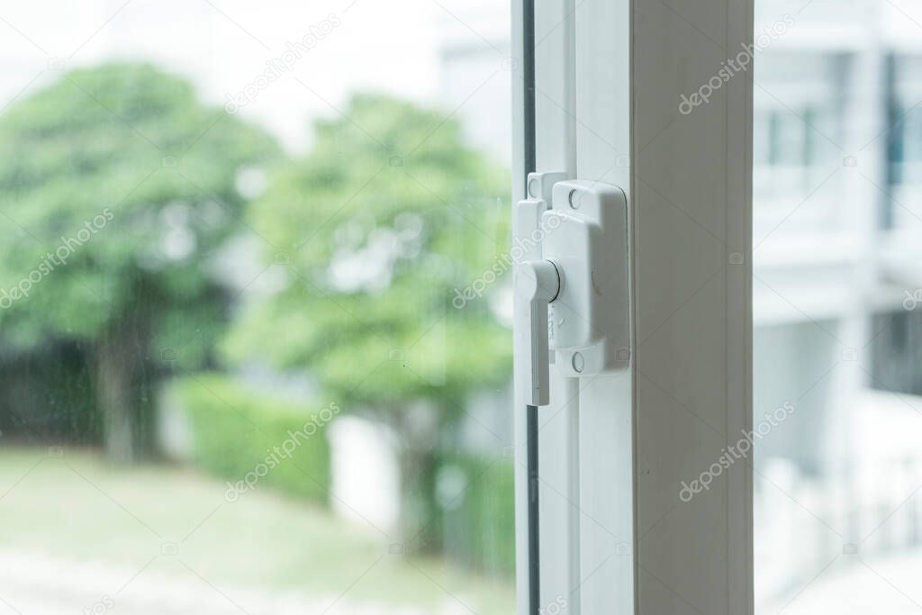 plastic window with lock , look outside.
