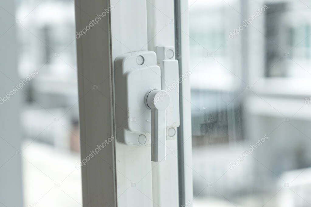 plastic window with lock , look outside.