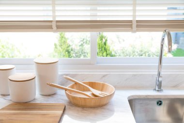 New sink and modern tap in stylish kitchen. Luxury new kitchen with marble top. Modern kitchen interior.