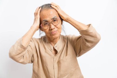 Senior asian women feeling headache, thinking of problems stand on white background.