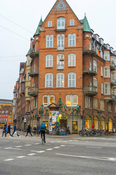 Copenhagen, Denmark - Nov 26, 2019 : People walking on the street near The King's Garden in Copenhagen, Denmark