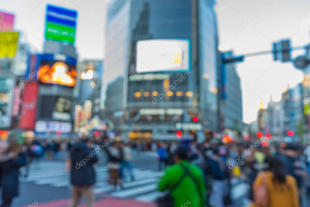 Blurred movement and people walking in Shibuya in Tokyo, Japan.