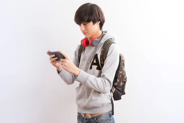 Young Man Mobile Phone Headphones White Background — 图库照片