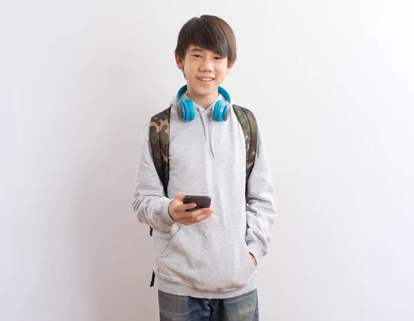 Young Asian Boy Backpack Smartphone White Background — Fotografia de Stock