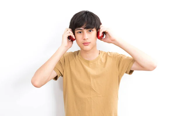 Teenager Boy Headphones His Head Listens Music White Background — Stock Photo, Image