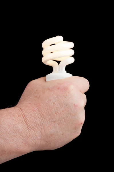 Magician holding a light bulb — Stock Photo, Image