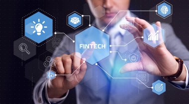 Fintech-Finansal Teknoloji Konsepti. Genç iş adamı sanal ekranda Fintech simgesini seçiyor..