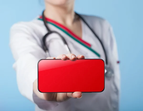 Woman doctor holding a smartphone. Business, technology, interne — Stock Photo, Image