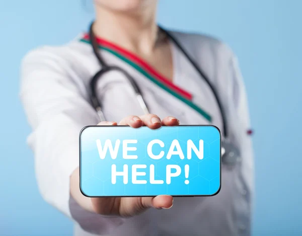 Girl holding Tablet with the diagnosis We can help on the displa — Stock Photo, Image