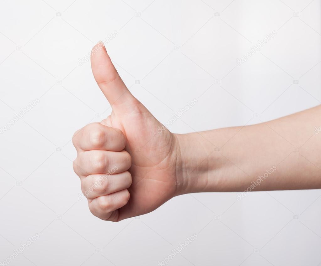 Approval thumbs up like sign as  hand gesture isolated over whit