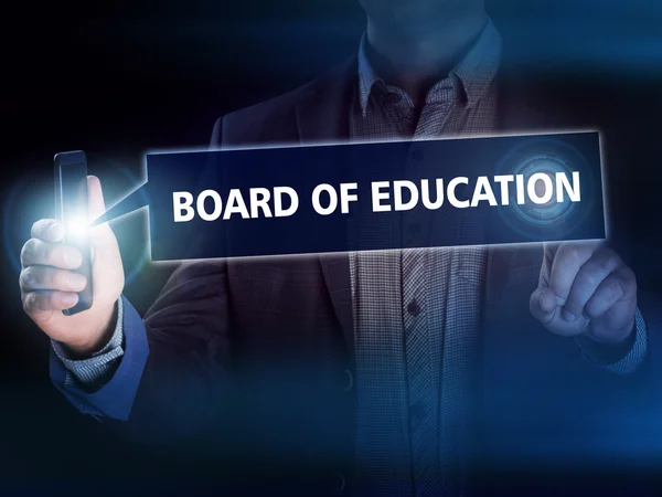 Businessman presses button board of education on virtual screens — Stock Photo, Image