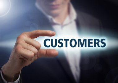 Businessman presses button  customers on virtual screens. Busine