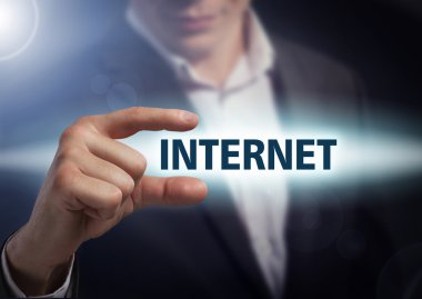 Businessman presses button  internet on virtual screens. Busines