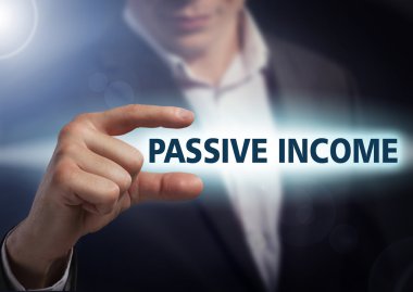Businessman presses button passive income on virtual screens. Bu clipart