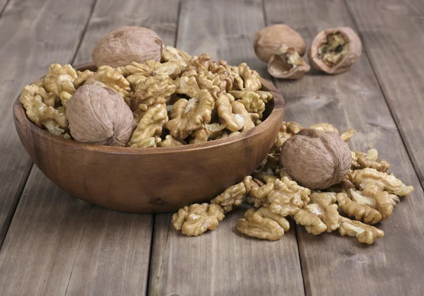 Walnuts in wooden bowl — Stock Photo, Image