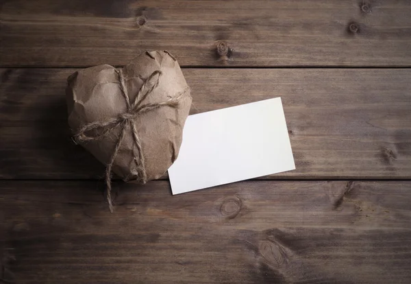 Heart wrapped in brown kraft paper — Stock Photo, Image