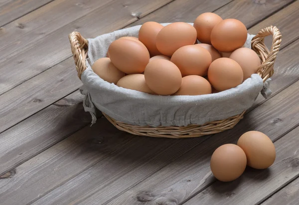 Chicken eggs in a basket — Stock Photo, Image