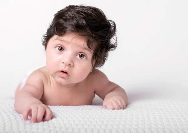 Baby with dark shaggy hair — Stock Photo, Image