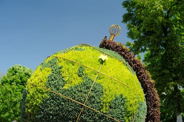 Topiary globe made of green plants in Orel, Russia