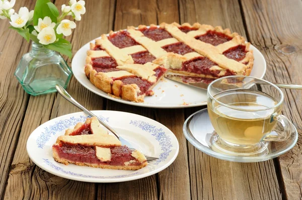 Lattice cake with strawberry jam cut, piece of cake, jasmine flo