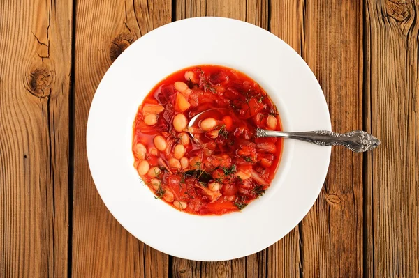 Portion of homemade Russian red beet soup borsch with bean, cabb — Stock Image Portion of homemade Russian red beet soup borsch with bean, cabb Royalty Free Stock Photos