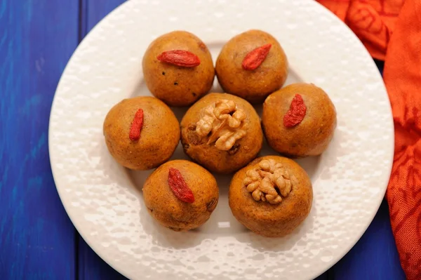Besan laddu, vegan Indian sweets with wallnuts and goji berries