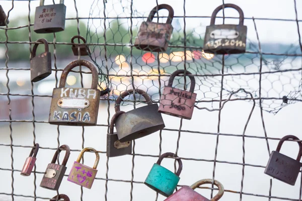 Love padlocks hanging on bridge — Stock Photo, Image