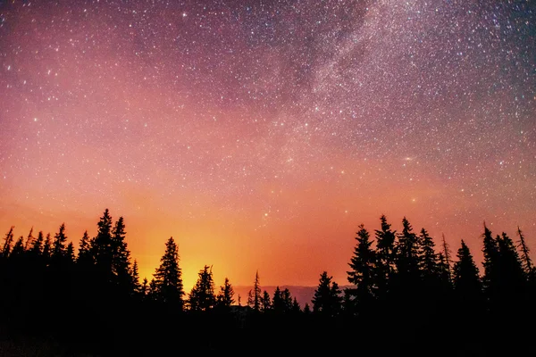 deep sky astrophoto. fantastic winter meteor rain and mountains in the mist.