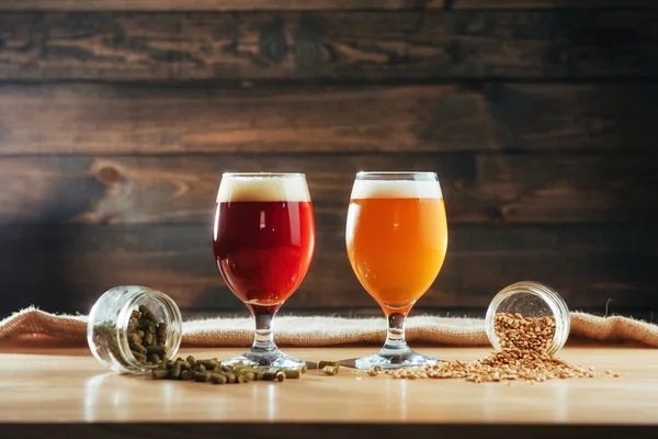 Two Glasses Beer Wooden Table Grains Hops — Stock Photo, Image