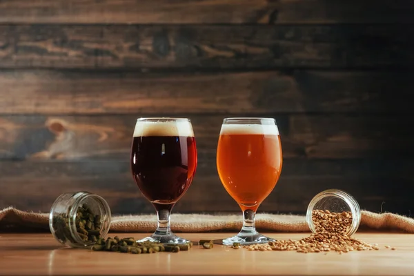 Two Glasses Beer Wooden Table Grains Hops — Stock Photo, Image