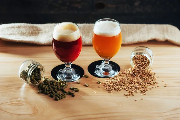 Two Glasses Beer Wooden Table Grains Hops — Stock Photo, Image